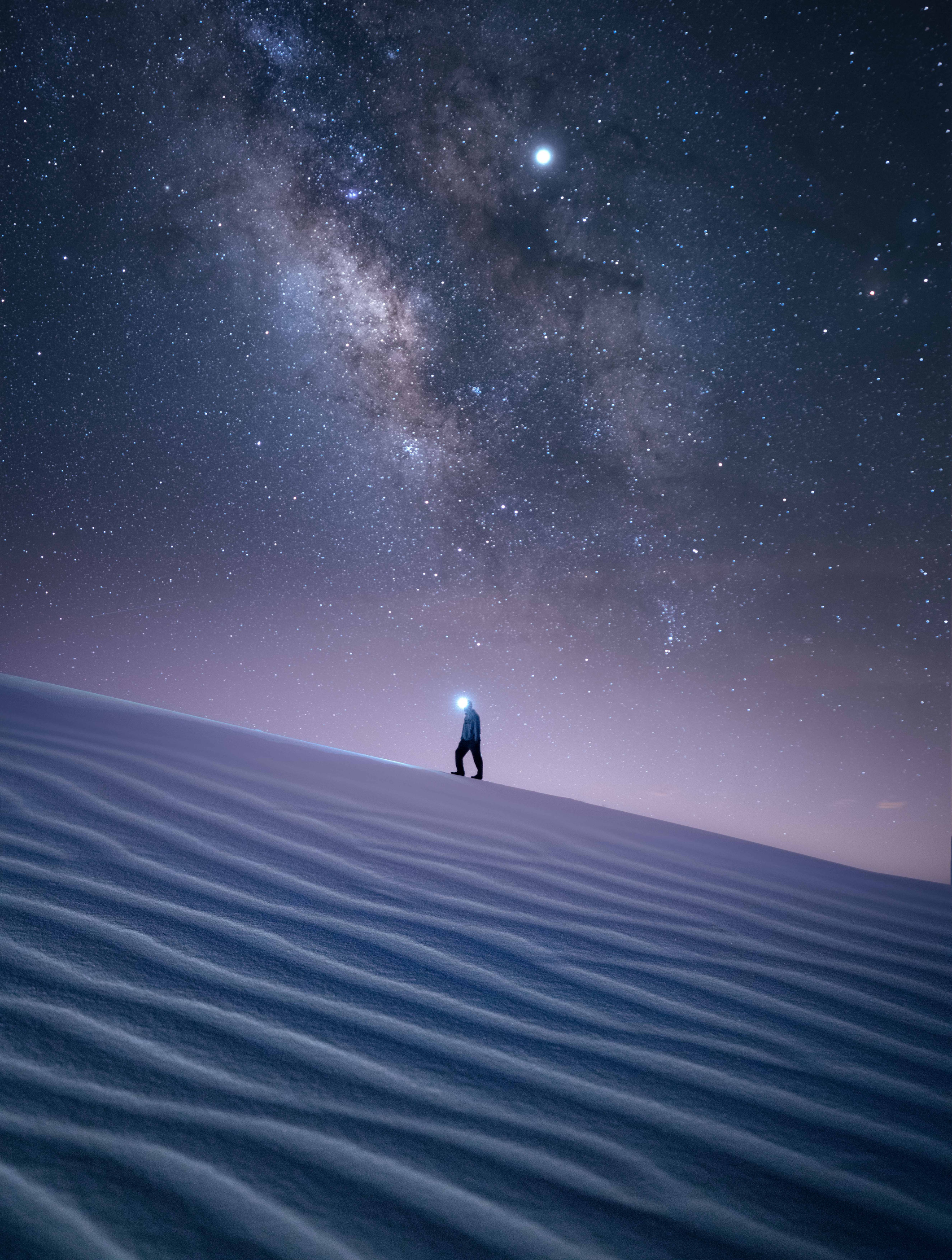 Photo of a Person at Night in the Desert